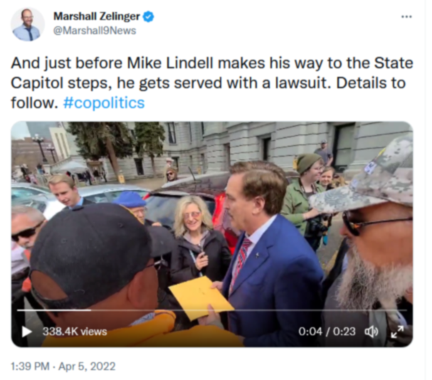 screenshot from Marshall Zelinger's twitter post showing Mike Lindell being served with court papers.